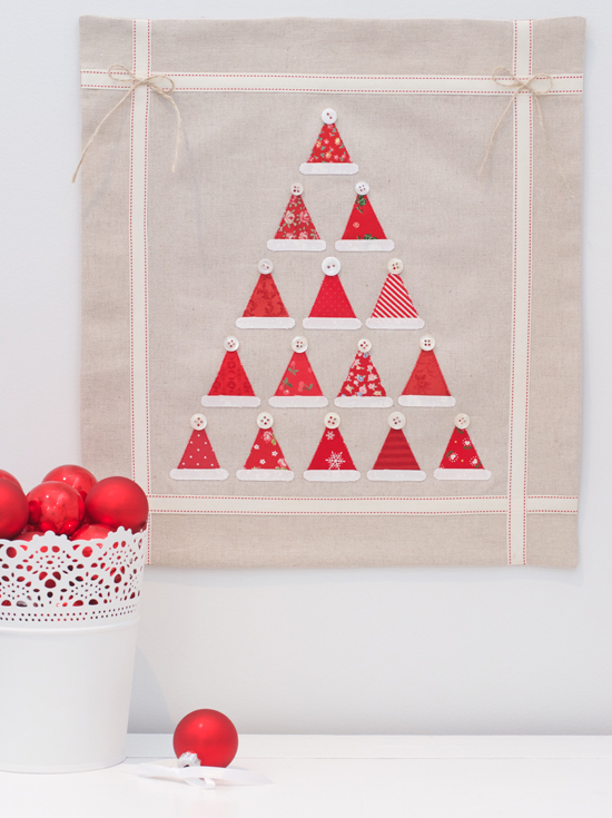 "Santa Hat" is a Free Mini Christmas Quilt Patterns Pattern designed by Kristyne Czepuryk from Pretty By Hand!